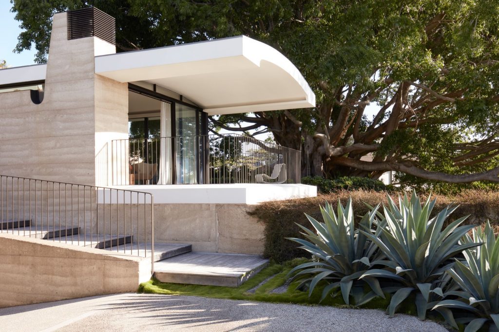 Modern coastal architecture & interior design of Casa Figueira, a luxury home with rammed earth walls & bespoke, crafted details in Sydney